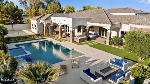 a view of a patio with swimming pool table and chairs