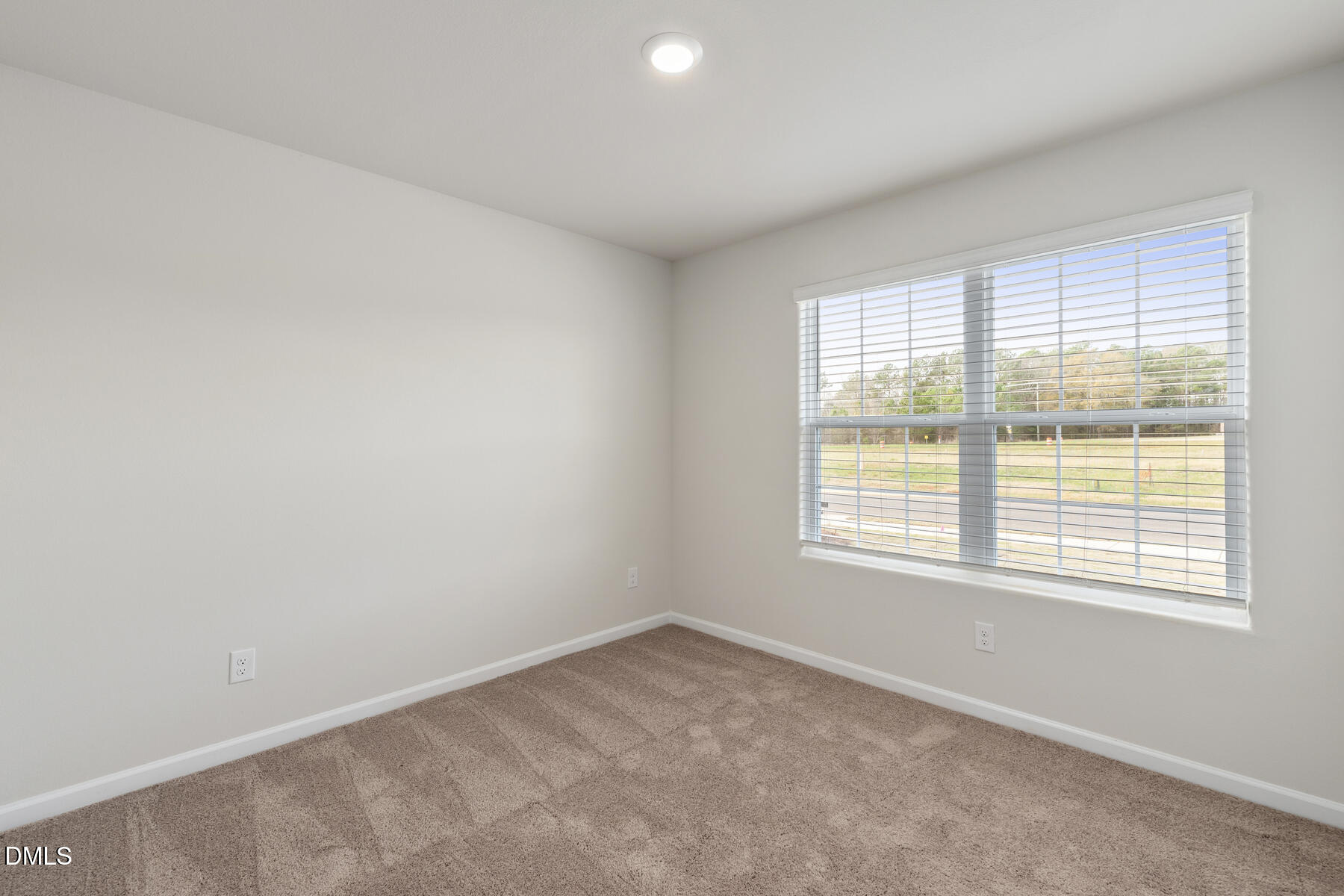 26 Crow Field Street Roxboro, NC 27574 - Photo 10 of 11 an empty room with a window
