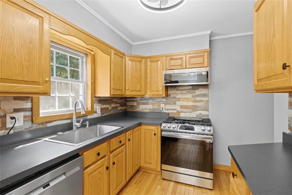 366 Claytonia Road Slippery Rock, PA 16057 - Photo 12 of 38 a kitchen with granite countertop a sink cabinets and stainless steel appliances