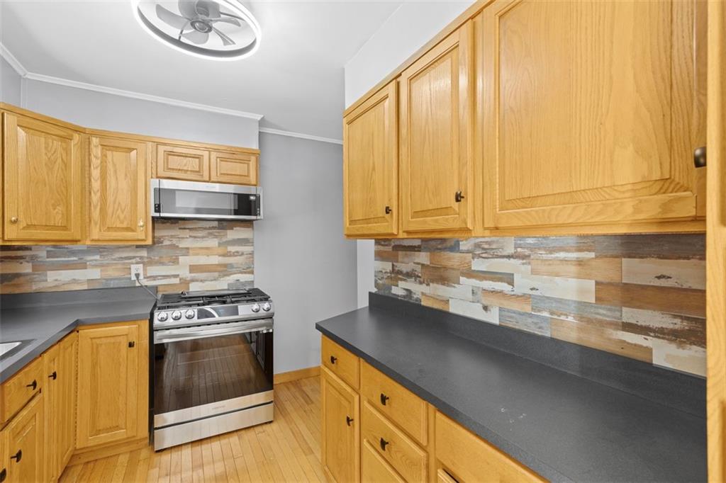 366 Claytonia Road Slippery Rock, PA 16057 - Photo 13 of 38 a kitchen with stainless steel appliances a stove a sink and cabinets