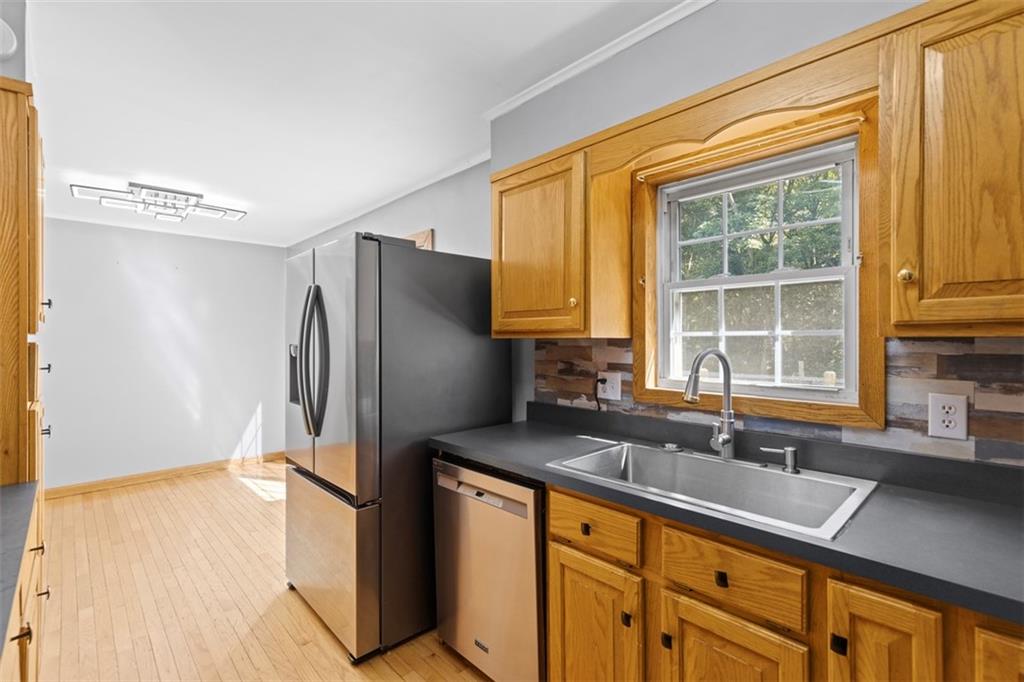 366 Claytonia Road Slippery Rock, PA 16057 - Photo 14 of 38 a kitchen with stainless steel appliances granite countertop a refrigerator and a sink