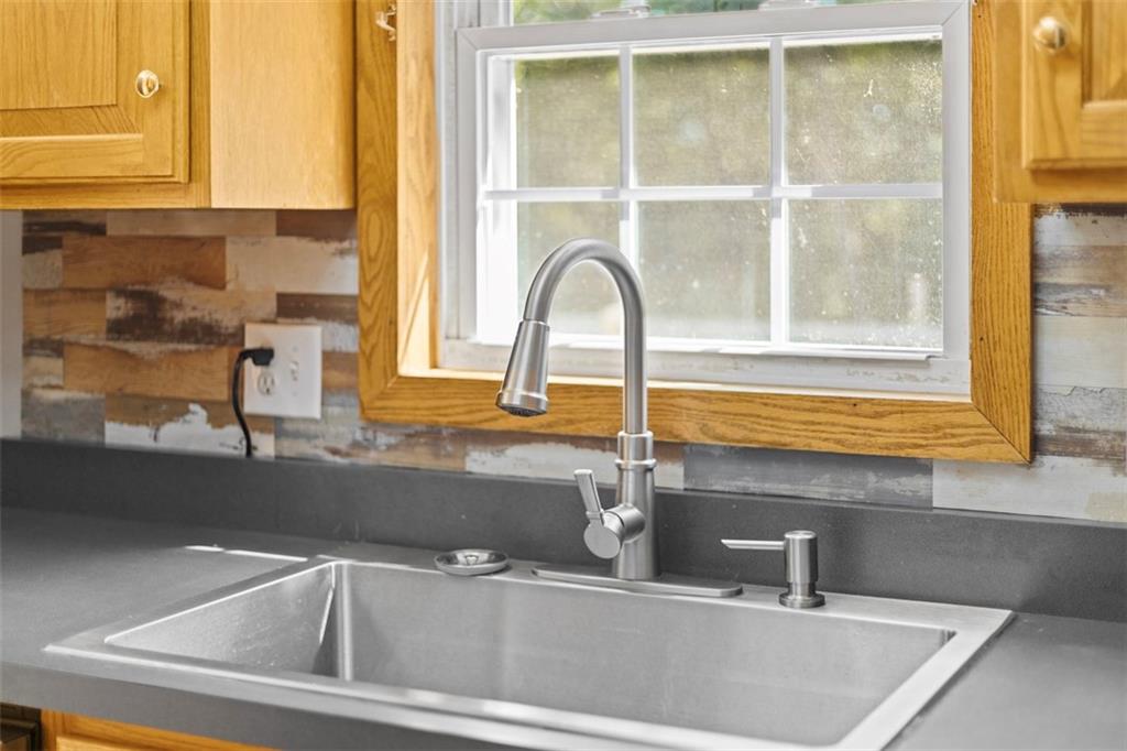 366 Claytonia Road Slippery Rock, PA 16057 - Photo 16 of 38 a bathroom with a sink and a window