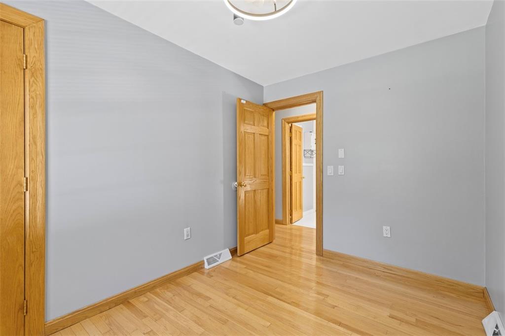 366 Claytonia Road Slippery Rock, PA 16057 - Photo 19 of 38 a view of an empty room with wooden floor and a window