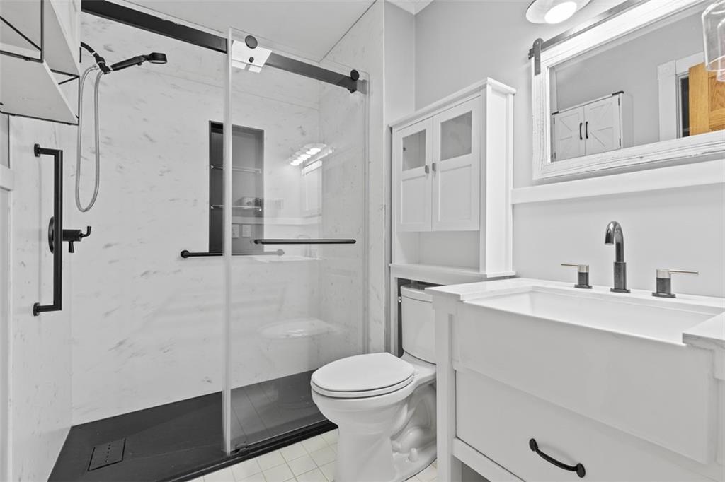 366 Claytonia Road Slippery Rock, PA 16057 - Photo 20 of 38 a bathroom with a sink a toilet and shower