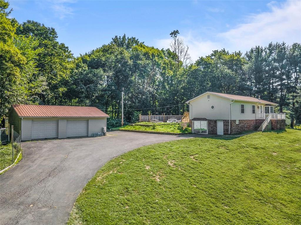 366 Claytonia Road Slippery Rock, PA 16057 - Photo 2 of 38 a front view of a house with garden