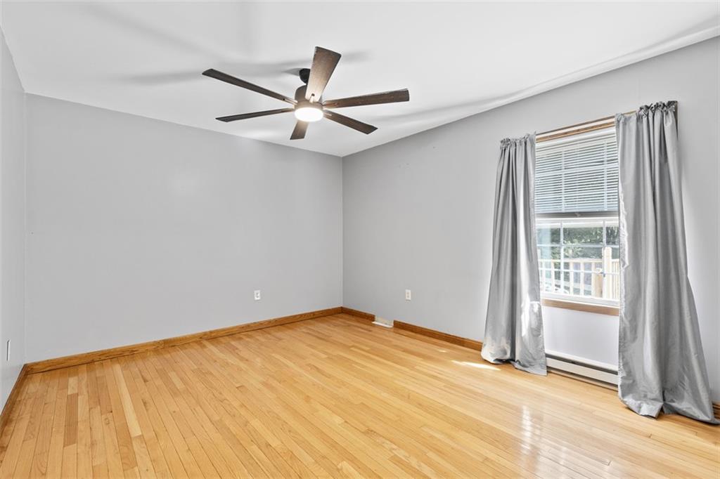366 Claytonia Road Slippery Rock, PA 16057 - Photo 21 of 38 an empty room with a ceiling fan and windows