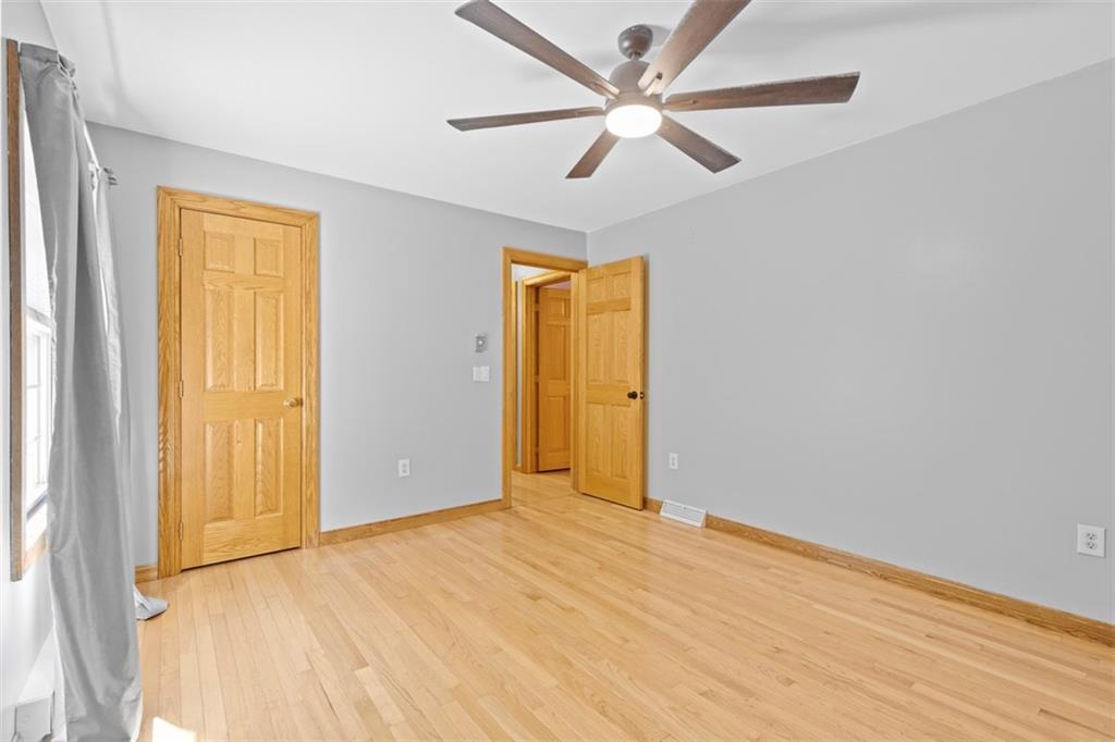 366 Claytonia Road Slippery Rock, PA 16057 - Photo 22 of 38 a view of empty room with wooden floor and fan