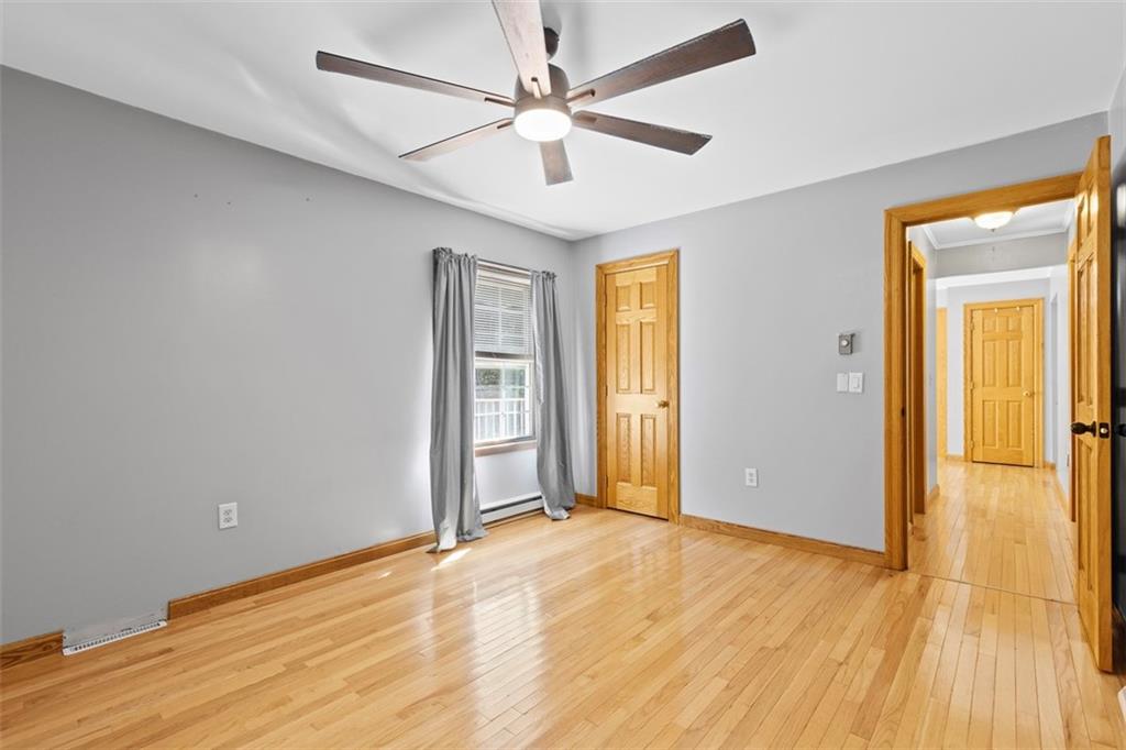366 Claytonia Road Slippery Rock, PA 16057 - Photo 23 of 38 a view of an empty room with window and wooden floor