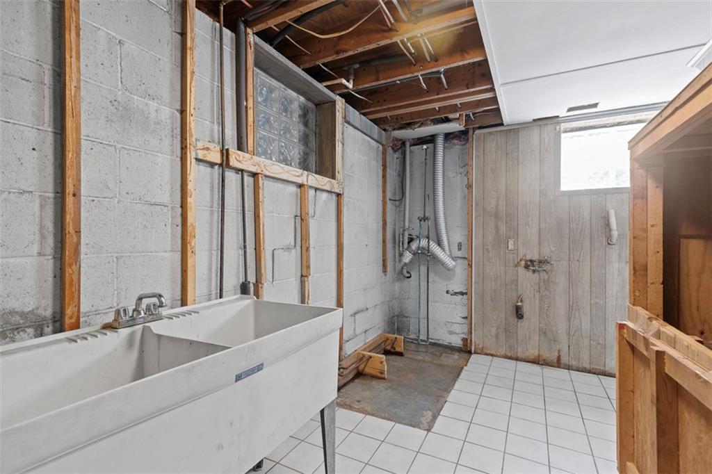 366 Claytonia Road Slippery Rock, PA 16057 - Photo 28 of 38 a bathroom with a tub a sink and a large mirror