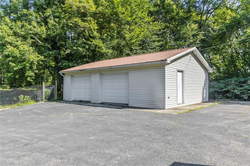 366 Claytonia Road Slippery Rock, PA 16057 - Photo 35 of 38 a view of a house with a yard and large tree