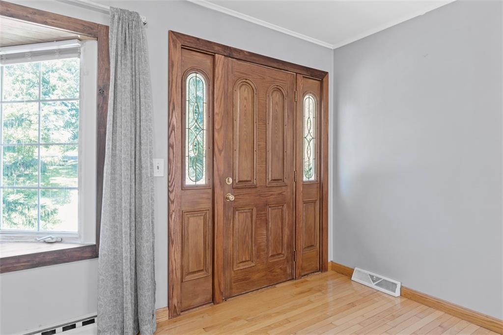 366 Claytonia Road Slippery Rock, PA 16057 - Photo 5 of 38 an empty room with wooden floor and a window