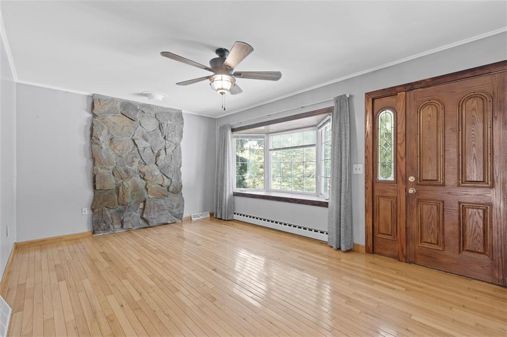 366 Claytonia Road Slippery Rock, PA 16057 - Photo 6 of 38 a view of empty room with wooden floor and fan