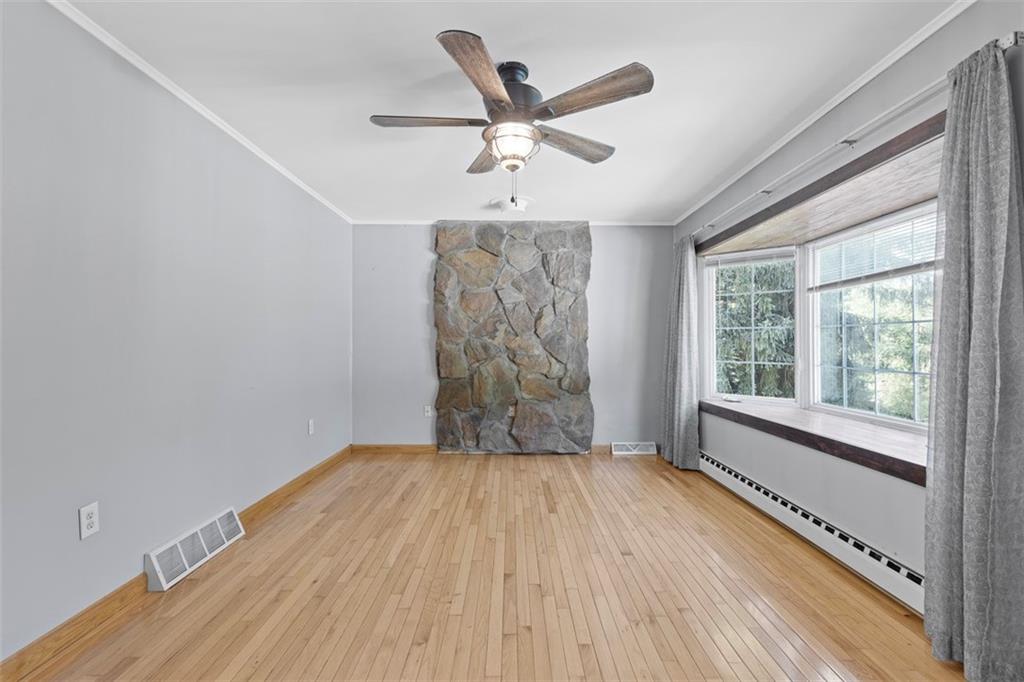 366 Claytonia Road Slippery Rock, PA 16057 - Photo 7 of 38 a view of empty room with wooden floor and fan