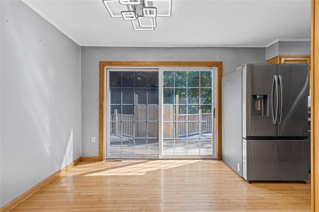 366 Claytonia Road Slippery Rock, PA 16057 - Photo 10 of 38 a view of empty room with wooden floor and fan