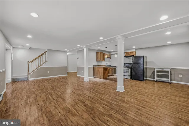 a view of a hall with wooden floor