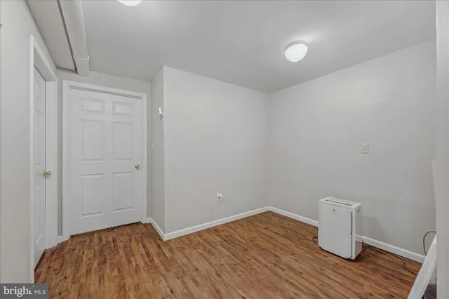 a view of room with wooden floor