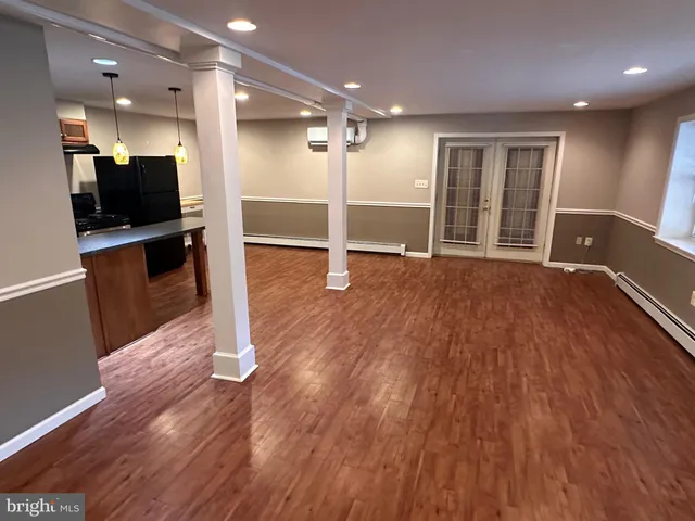 a view of a livingroom with wooden floor