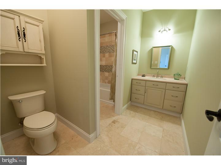 310 West Sandy Ridge Road Doylestown, PA 18901 - Photo 22 of 24 a bathroom with a toilet sink and mirror