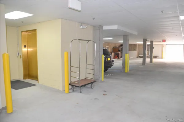 a view of a hallway with two chairs