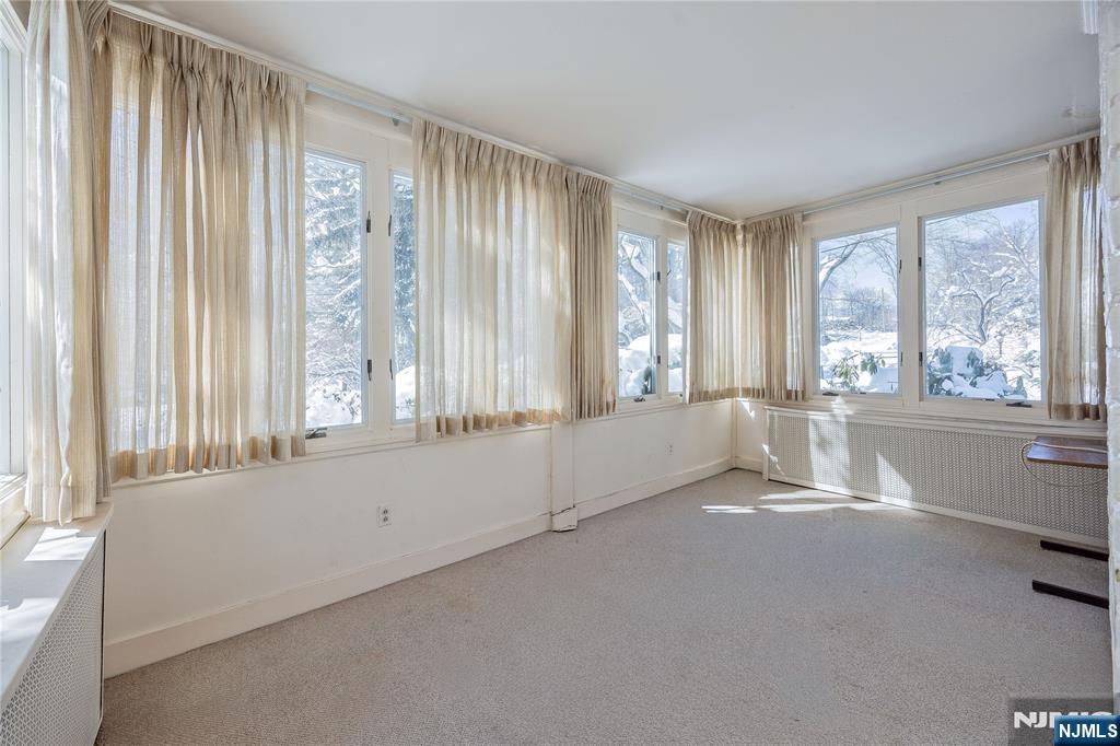 76 Forest Road Tenafly, NJ 07670 - Photo 11 of 32 a view of an empty room with a window