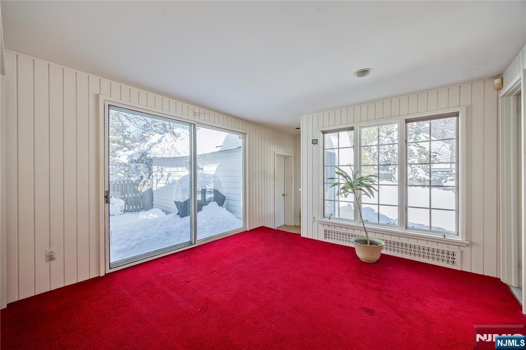 76 Forest Road Tenafly, NJ 07670 - Photo 12 of 32 a view of empty room with wooden floor and fan