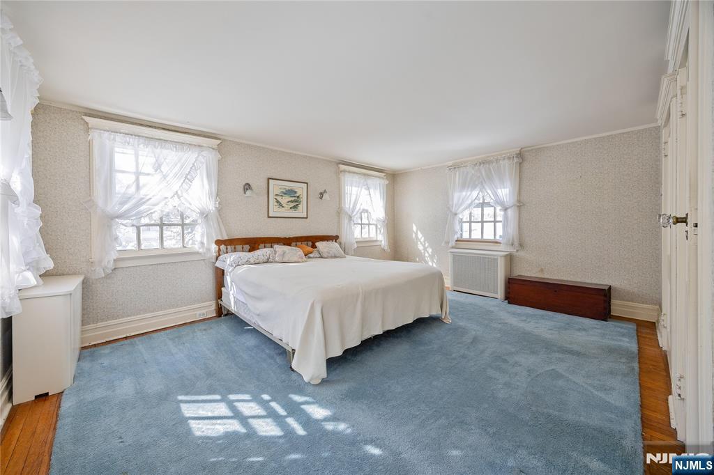 76 Forest Road Tenafly, NJ 07670 - Photo 16 of 32 a bedroom with a bed and a window