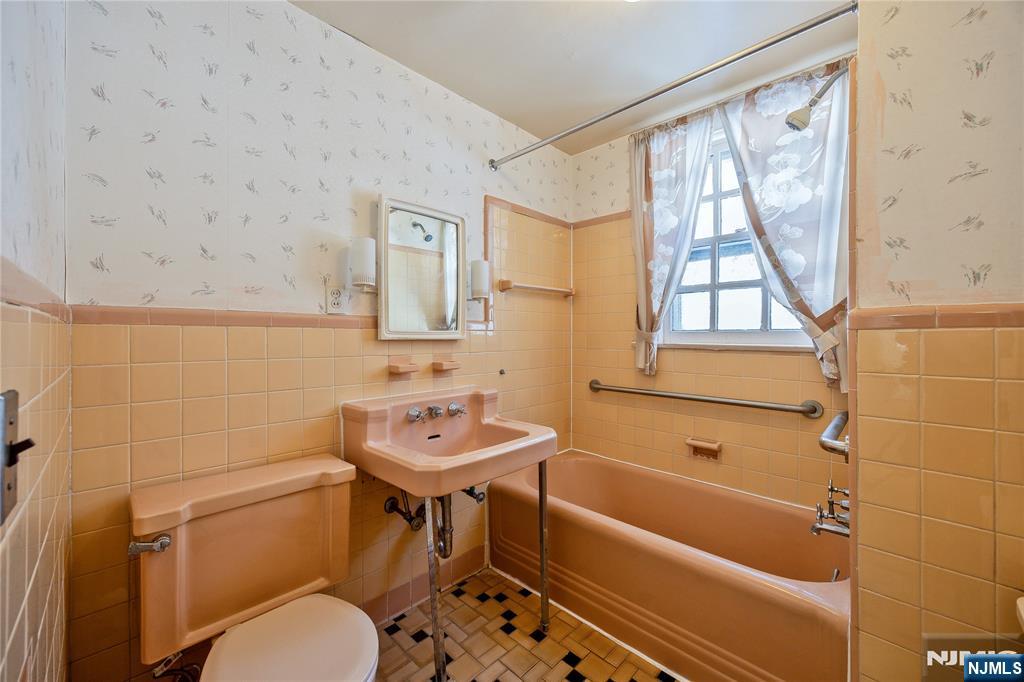 76 Forest Road Tenafly, NJ 07670 - Photo 20 of 32 a bathroom with a sink a toilet and a bathtub