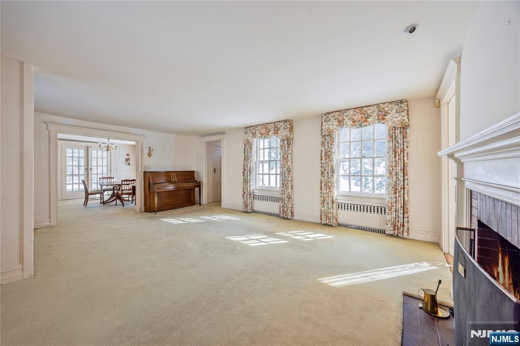 76 Forest Road Tenafly, NJ 07670 - Photo 7 of 32 a view of livingroom with furniture and fireplace