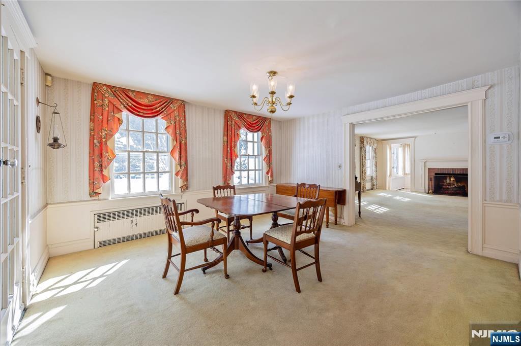 76 Forest Road Tenafly, NJ 07670 - Photo 10 of 32 a view of a dining room with furniture window and outside view