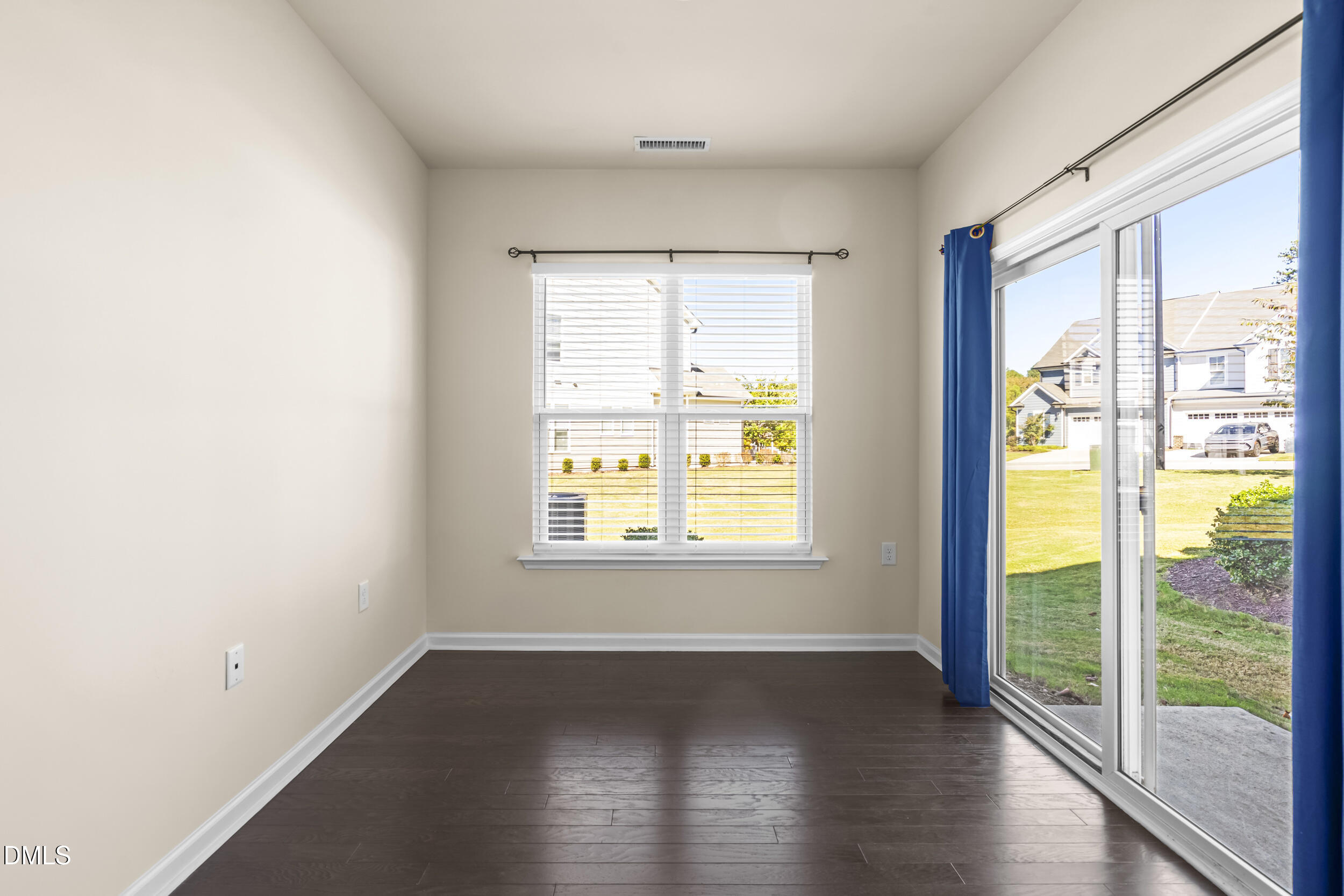 113 Lafferty Street Durham, NC 27560 - Photo 17 of 50 a view of an empty room with wooden floor and a window