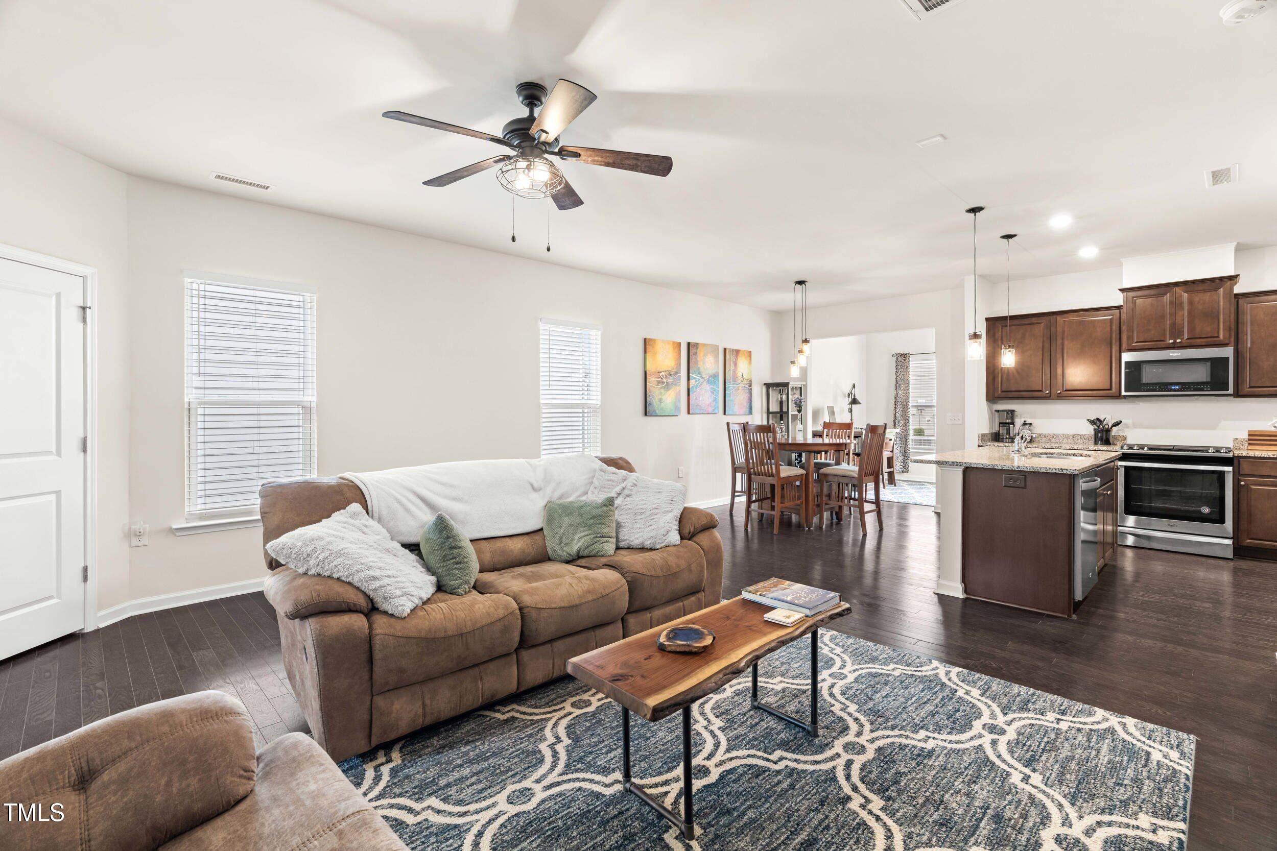 113 Lafferty Street Durham, NC 27560 - Photo 19 of 50 a living room with furniture kitchen view and a window