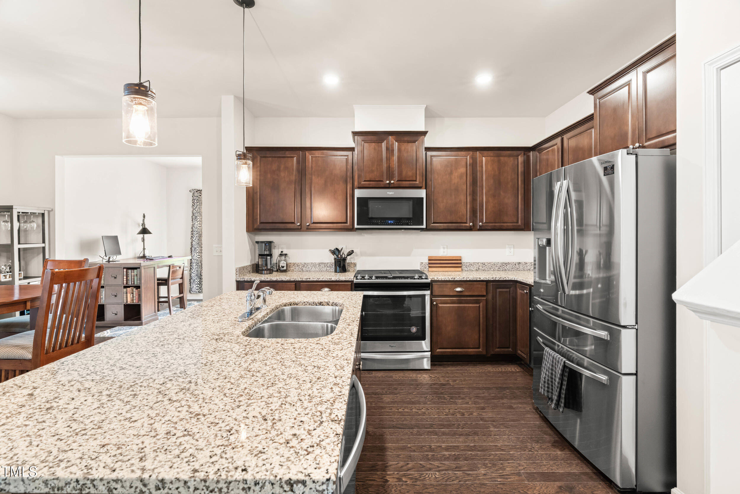 113 Lafferty Street Durham, NC 27560 - Photo 23 of 50 a kitchen with kitchen island a counter top space appliances and a center island