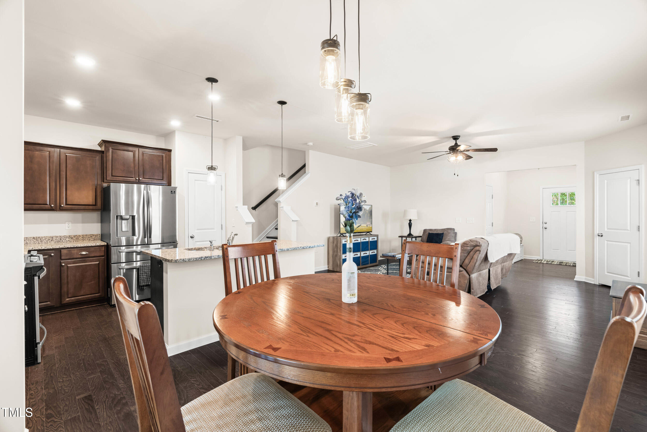 113 Lafferty Street Durham, NC 27560 - Photo 24 of 50 a dining room with furniture a chandelier and wooden floor