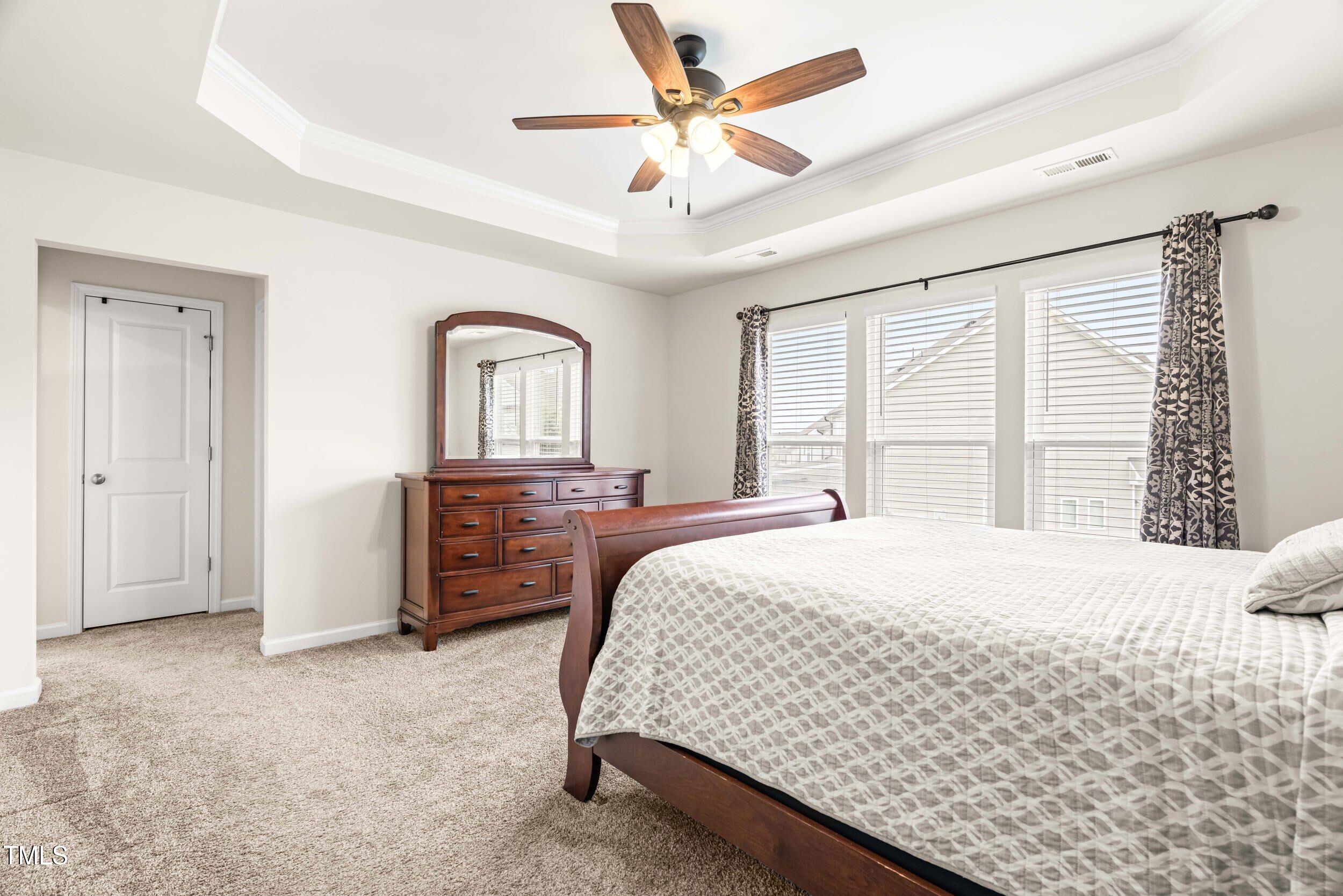 113 Lafferty Street Durham, NC 27560 - Photo 30 of 50 a bedroom with a bed dresser and a window