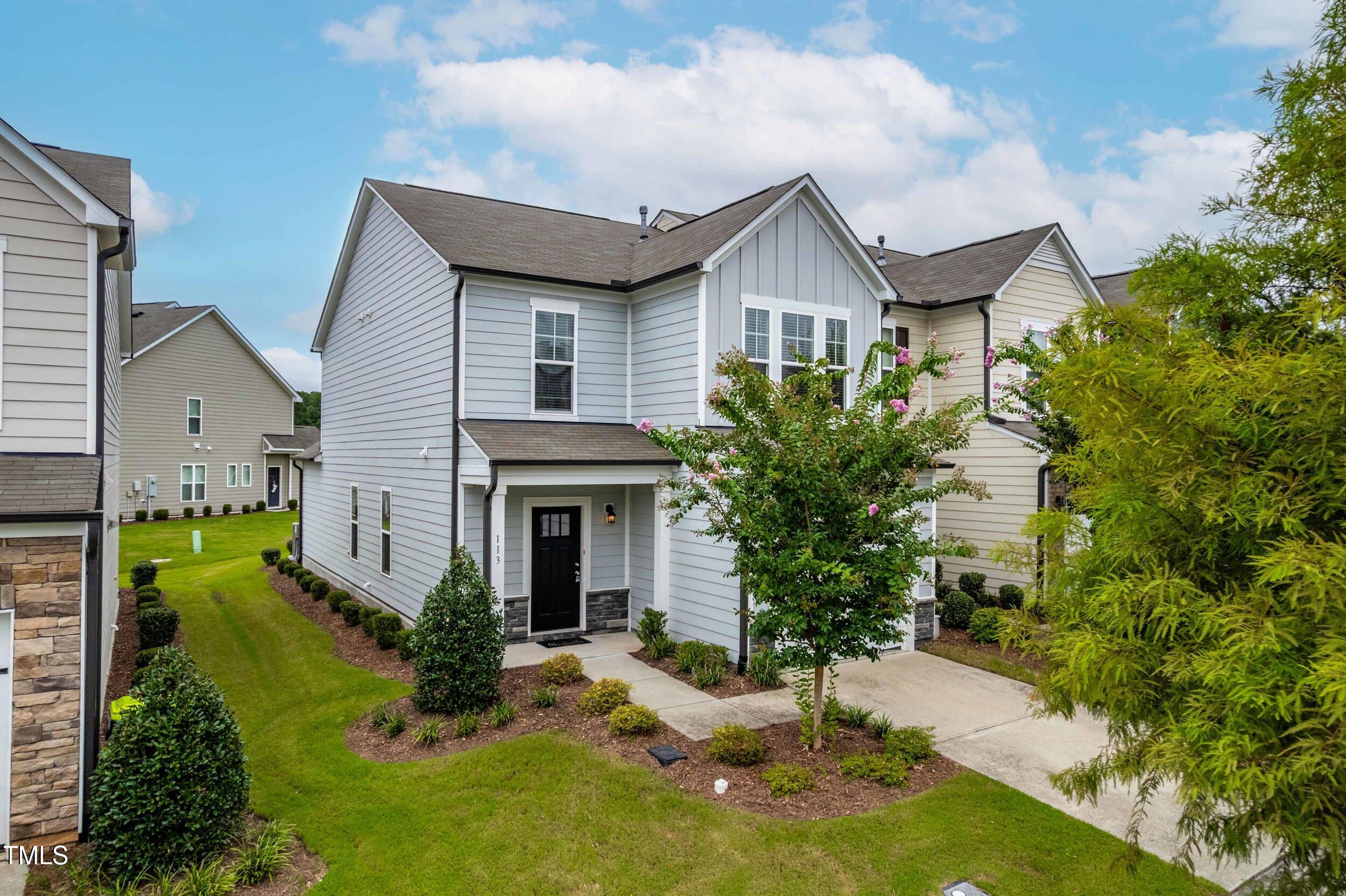 113 Lafferty Street Durham, NC 27560 - Photo 3 of 50 a front view of a house with a yard