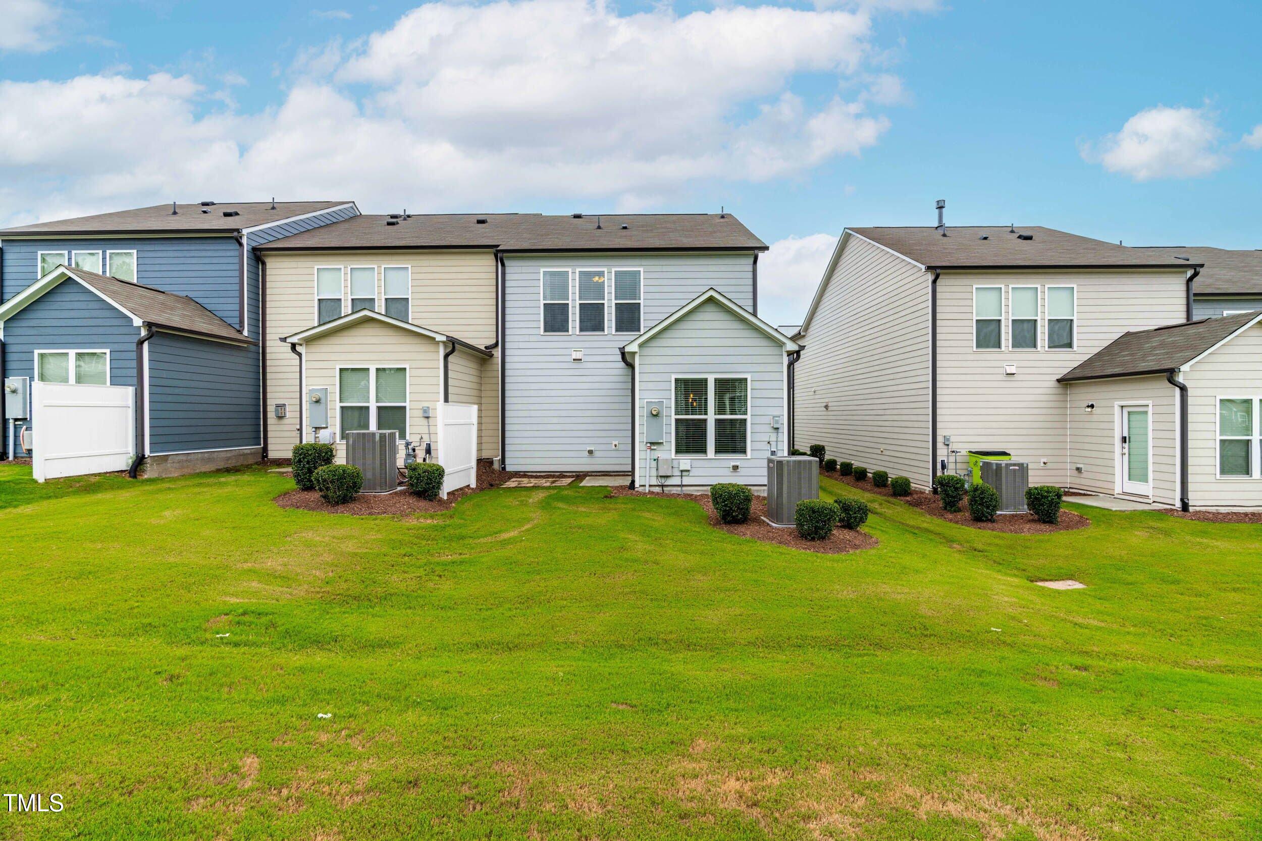 113 Lafferty Street Durham, NC 27560 - Photo 38 of 50 a front view of a house with a garden