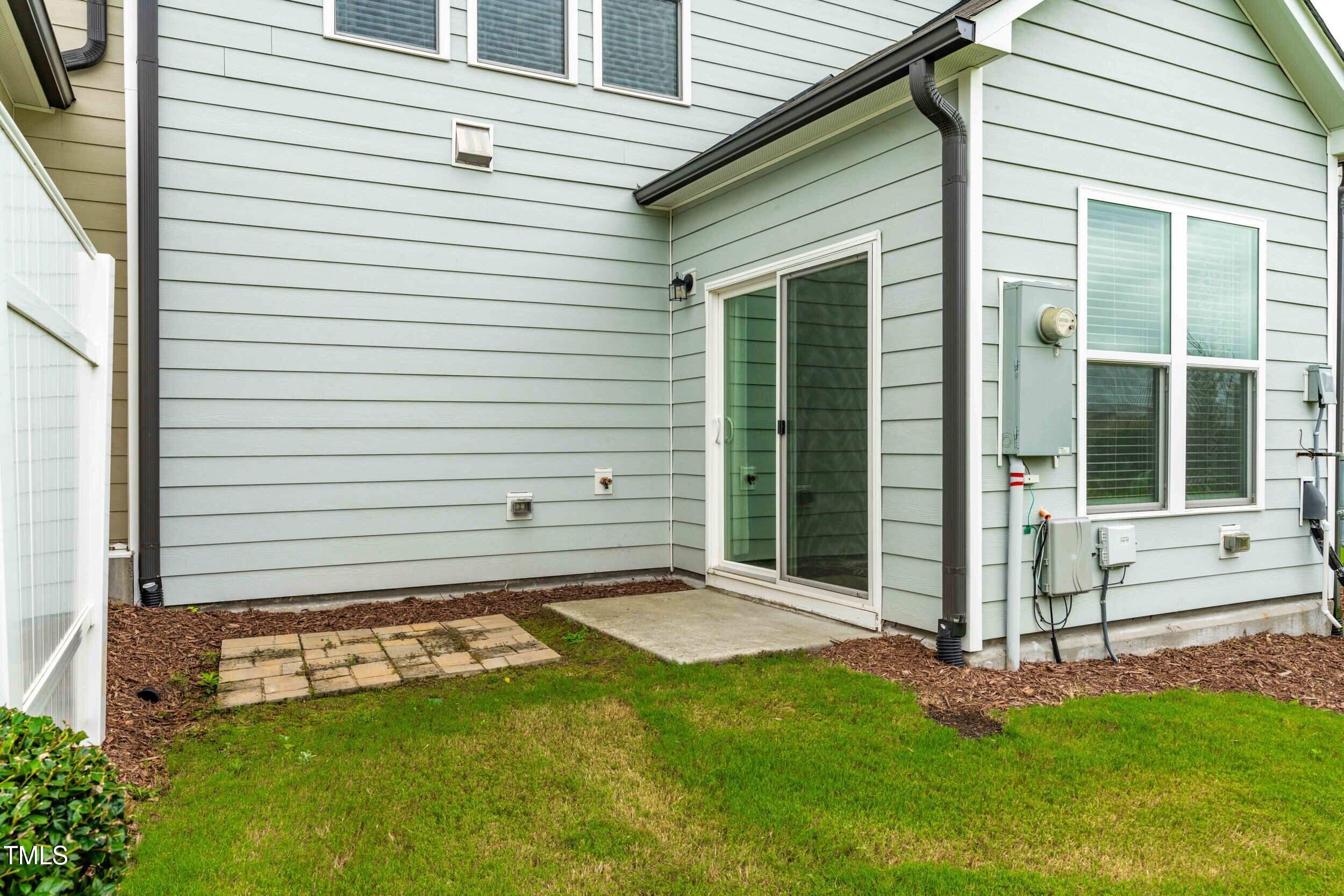 113 Lafferty Street Durham, NC 27560 - Photo 40 of 50 a view of a backyard with a small cabin