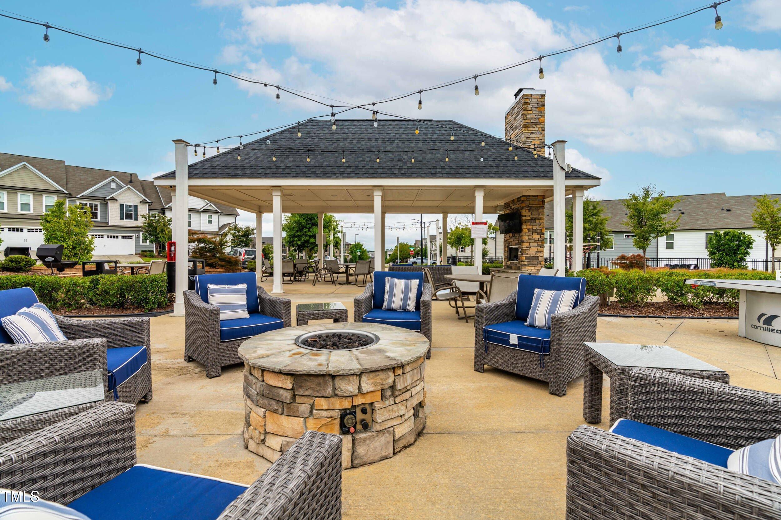 113 Lafferty Street Durham, NC 27560 - Photo 44 of 50 a view of a patio with dining table and chairs