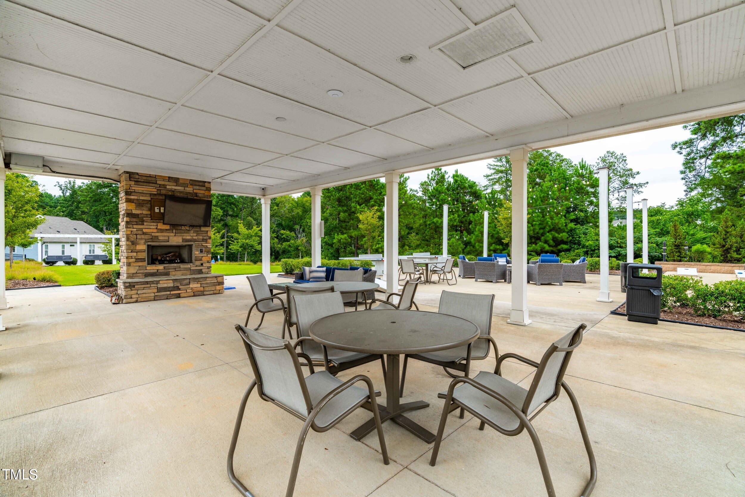 113 Lafferty Street Durham, NC 27560 - Photo 45 of 50 a patio with yard glass top table and chairs