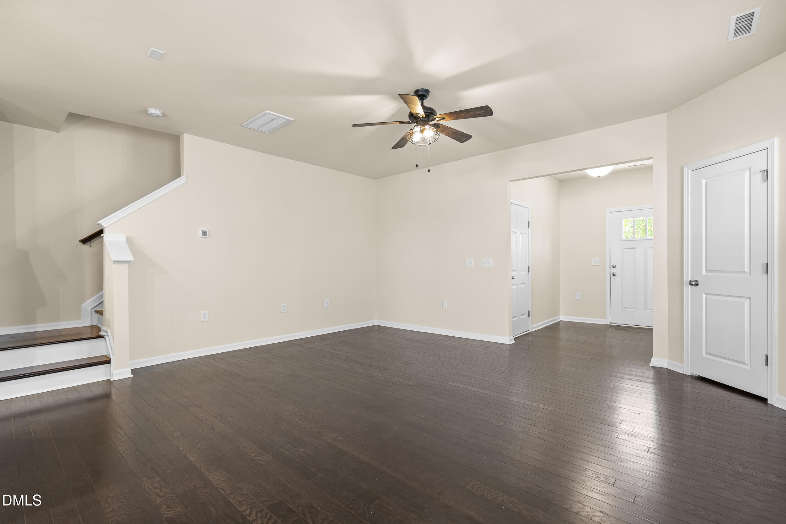 113 Lafferty Street Durham, NC 27560 - Photo 7 of 50 an empty room with wooden floor fan and windows