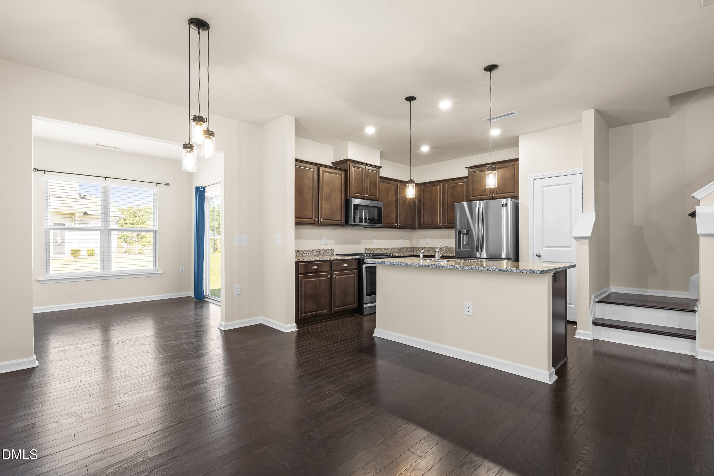 113 Lafferty Street Durham, NC 27560 - Photo 10 of 50 a view of a kitchen with a refrigerator a sink dishwasher and a stove top oven