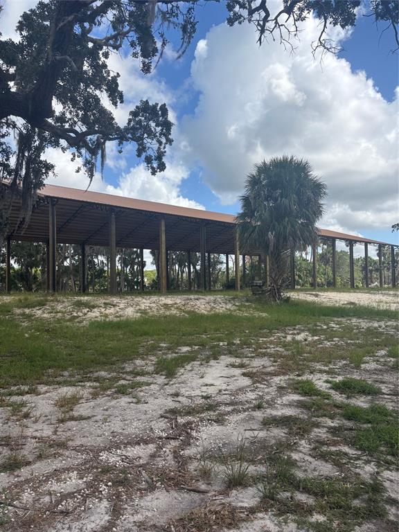3217 Shine Lane Spring Hill, FL 34607 - Photo 15 of 19 a view of a house with a yard