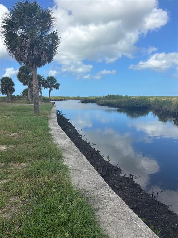 3217 Shine Lane Spring Hill, FL 34607 - Photo 9 of 19 a view of a lake with a lake