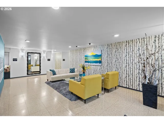 a living room with furniture and a rug