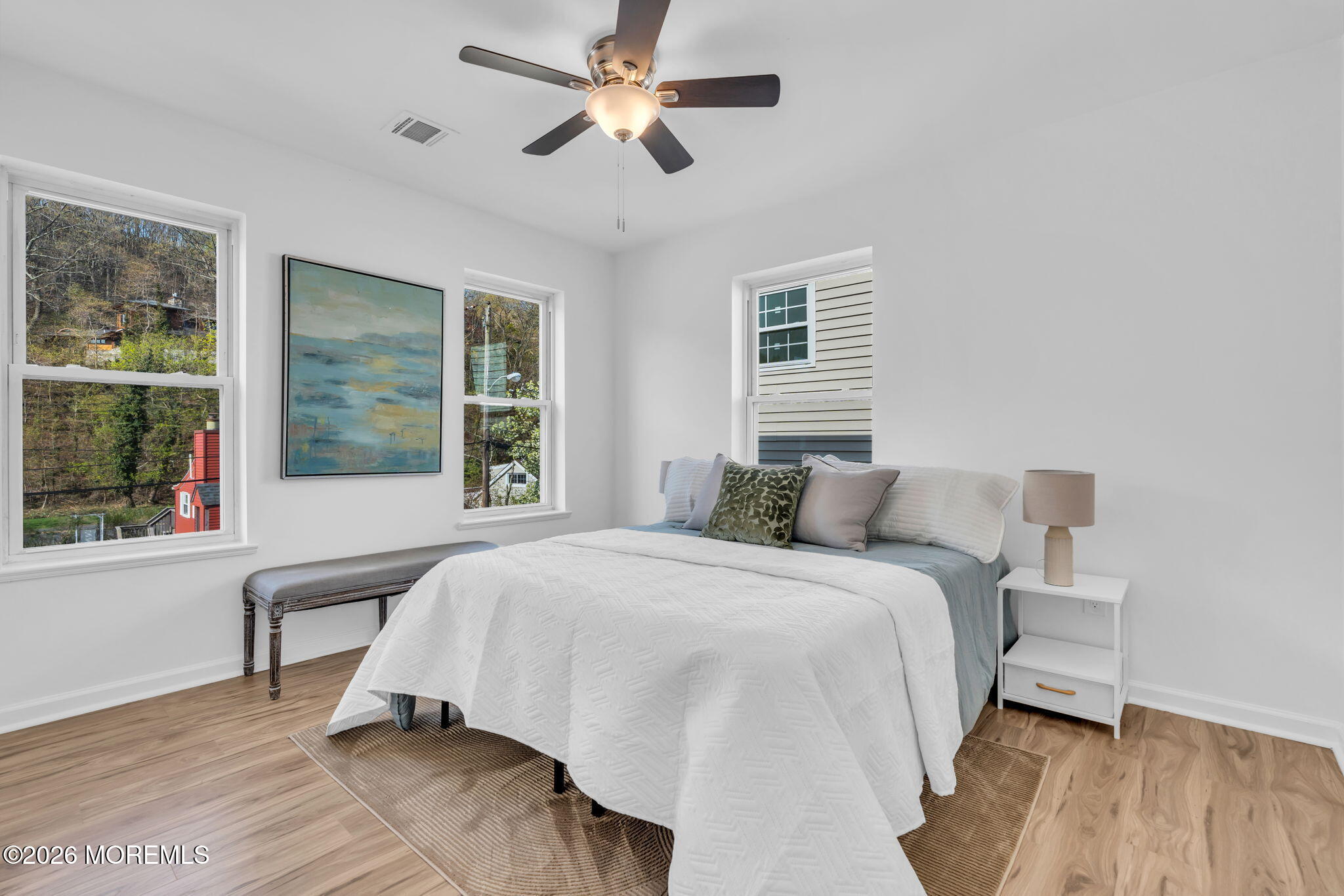 13 Locust Street Highlands, NJ 07732 - Photo 11 of 42 a bedroom with a large bed and a window