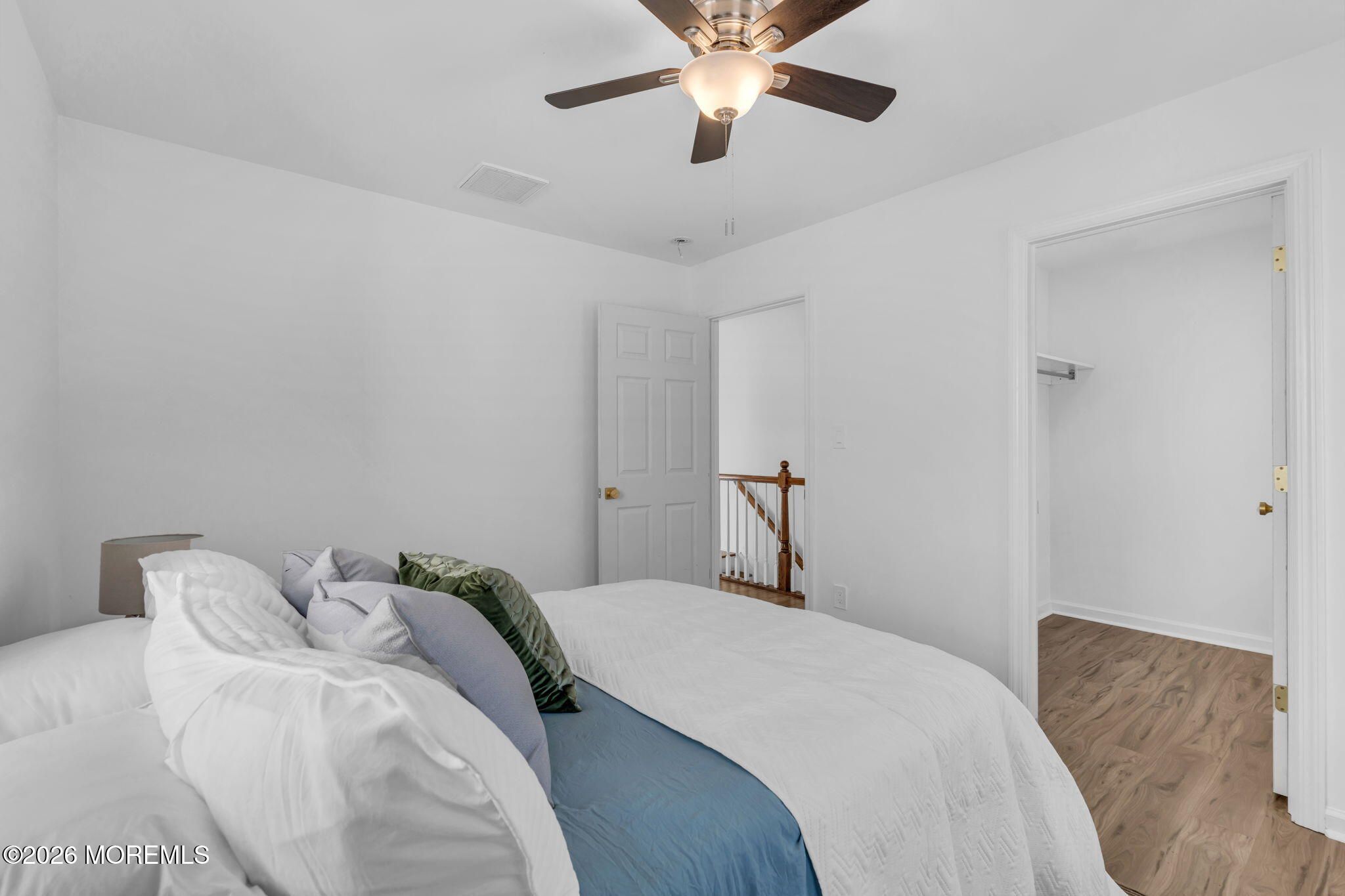13 Locust Street Highlands, NJ 07732 - Photo 13 of 42 a bedroom with a bed and a chandelier