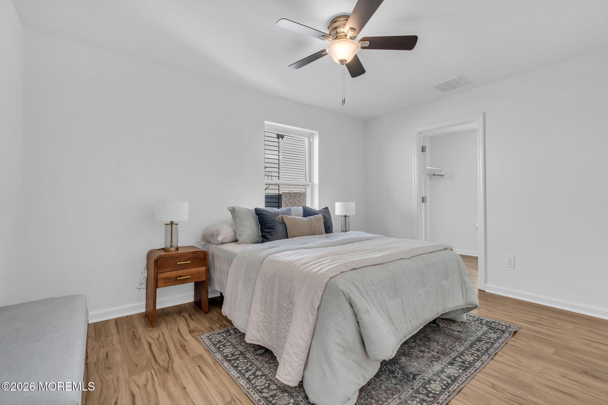 13 Locust Street Highlands, NJ 07732 - Photo 14 of 42 a bedroom with bed and a chandelier