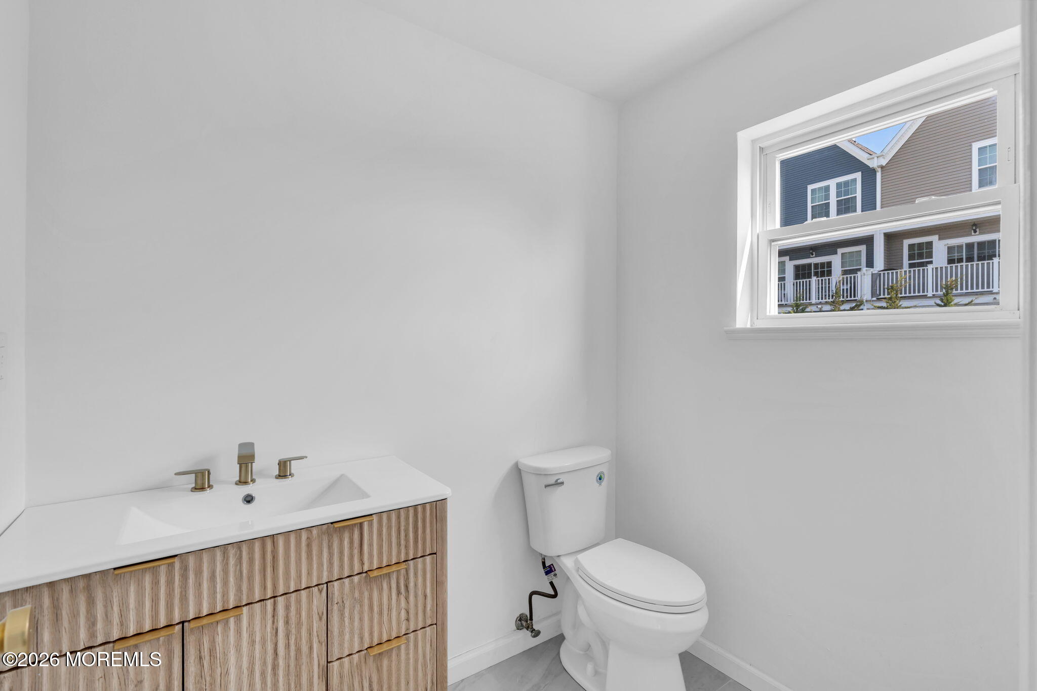13 Locust Street Highlands, NJ 07732 - Photo 20 of 42 a bathroom with a sink toilet and a mirror