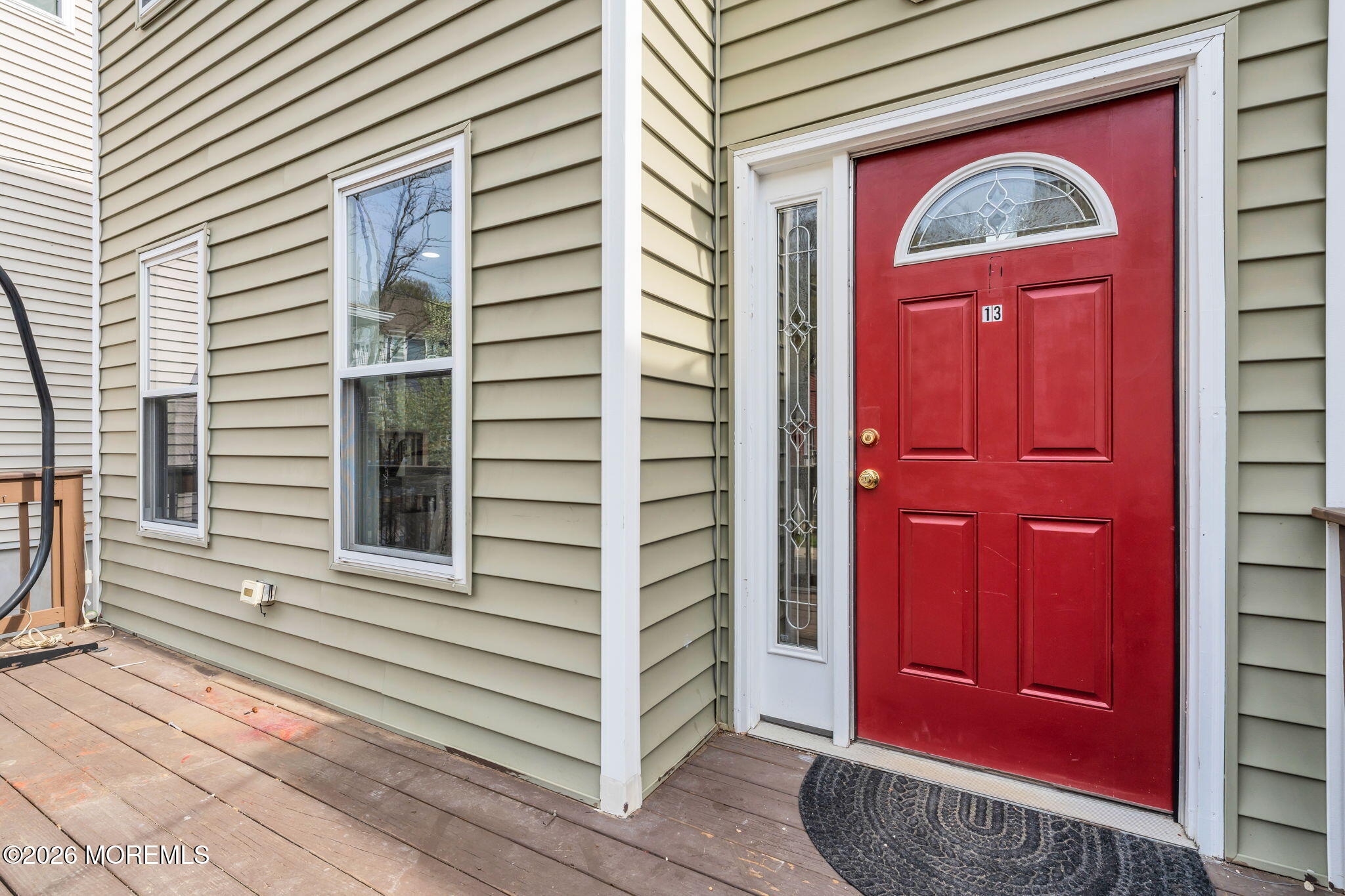 13 Locust Street Highlands, NJ 07732 - Photo 2 of 42 a view of a red door of the house