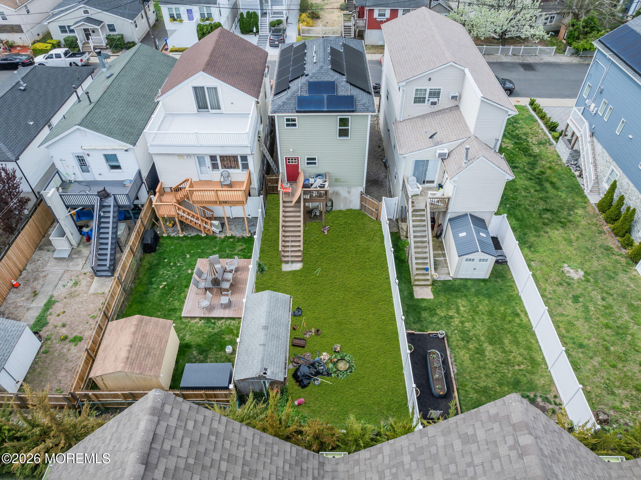 13 Locust Street Highlands, NJ 07732 - Photo 25 of 42 an aerial view of multiple houses with yard